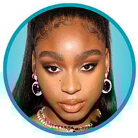 Normani looks serious.