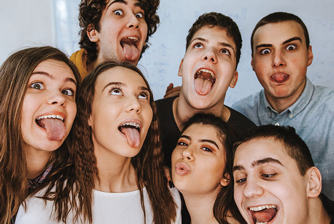 a group of friends sticking their tongues out
