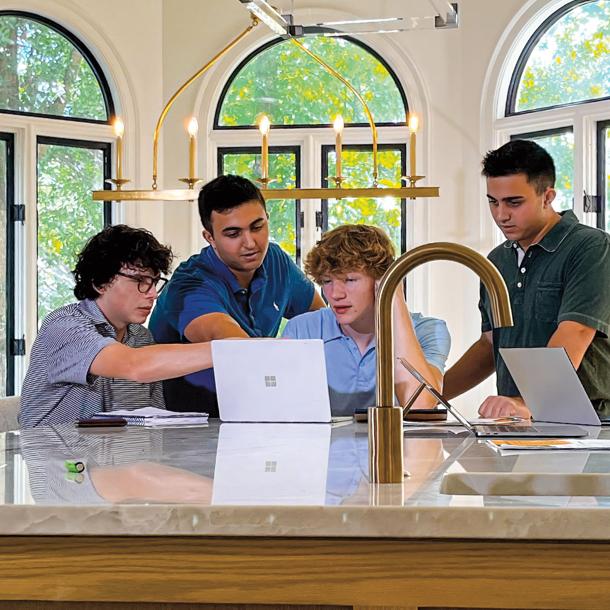 Photo of students working together on computers