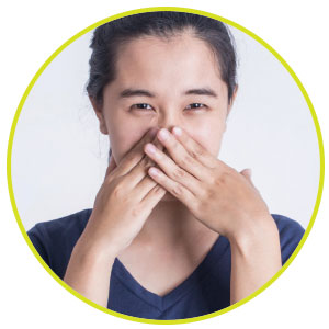 Image of a person covering their mouth