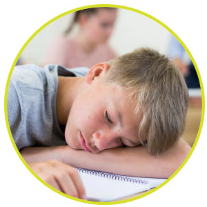 Image of a person sleeping at their desk