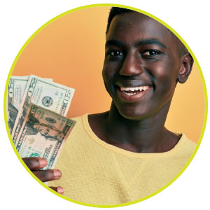 Image of a person smiling and holding cash