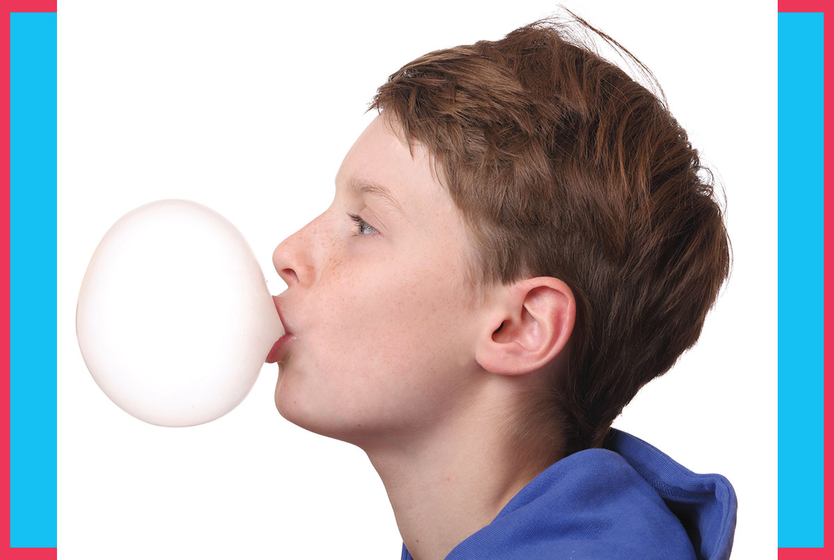 Image of a person blowing a bubble from gum