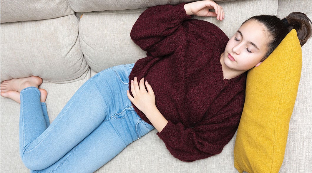 Photo of a person napping on a couch