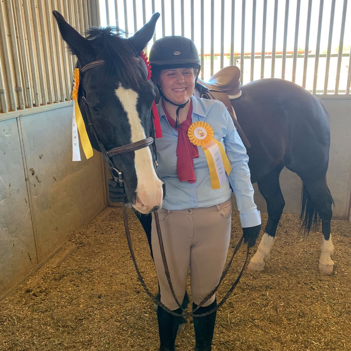 Image of person posing with their horse