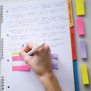 Image of person taking organized, color-coated notes