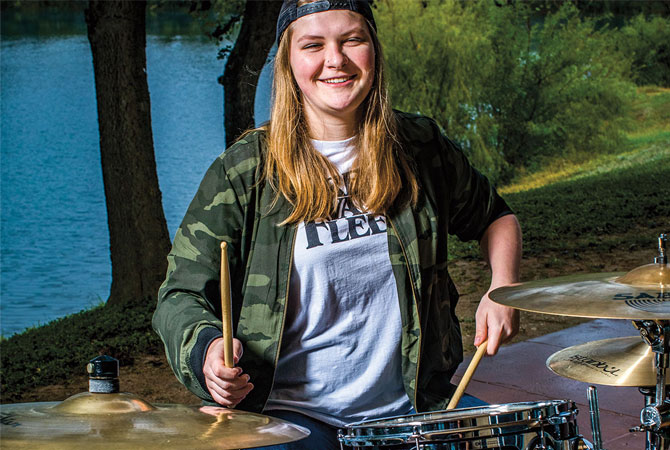 Girl playing drums