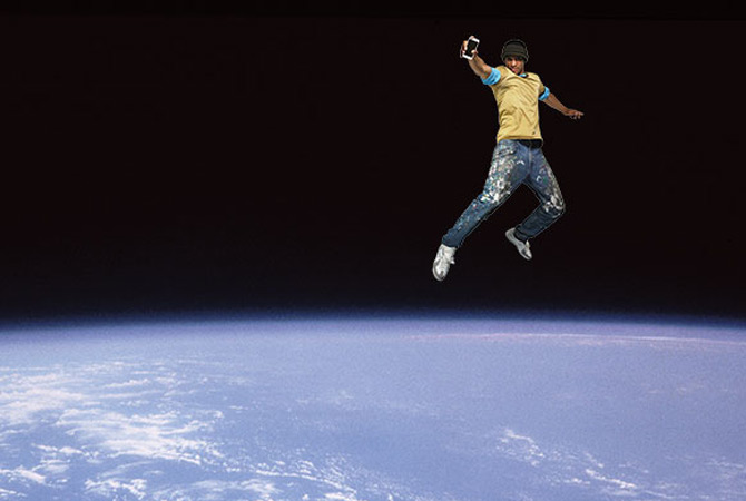 Boy jumping above earth